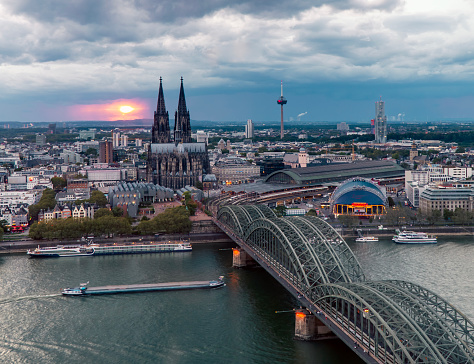 Dramatic thunderclouds over Cologne Cathedral and Hohenzollern Bridge in the evening