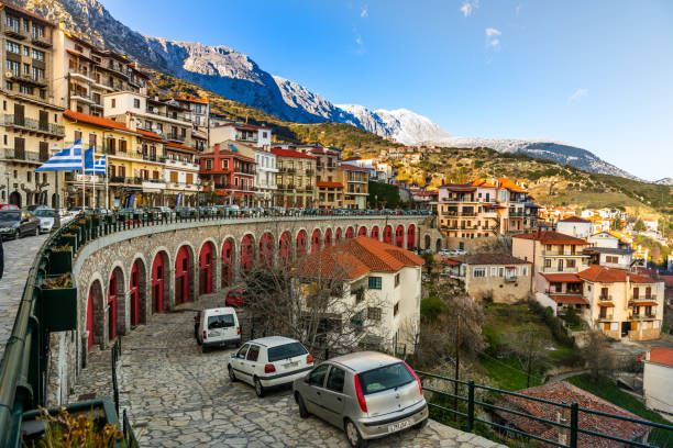 The town of Arachova, Greece Arachova, Greece - 13 March 2023 -Center of town build against a steep mountain in springtime arachova greece stock pictures, royalty-free photos & images