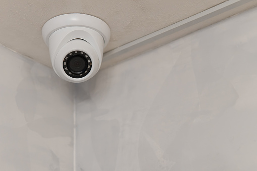 Security CCTV camera on ceiling, Intelligent cameras, Video recording, Anti-theft system, Surveillance.