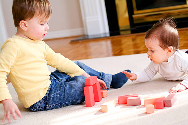 istock Brother and sister playing together 172973841