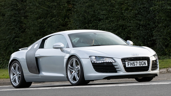 Bicester,Oxon.,UK - Oct 8th 2023: 2008 silver Audi R8  classic car driving on an English country road.