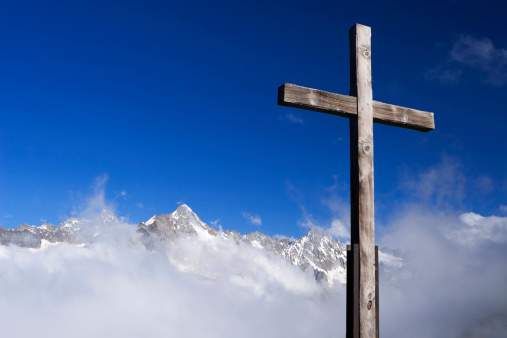 Cross on a mountain peak