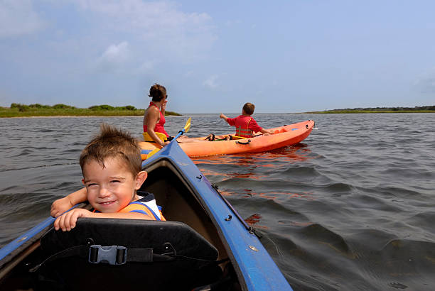 istock Child sea kayaking with family 172974294
