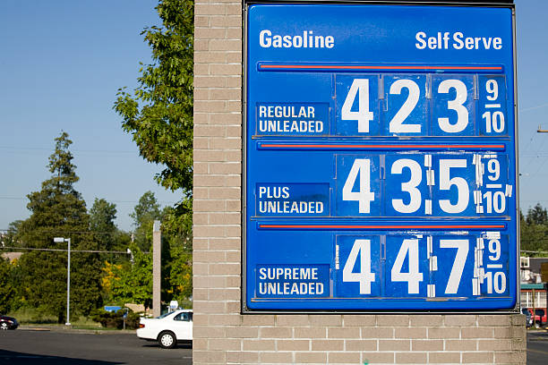 High Gas Prices and street scene Gas signs showing inflationary impact of rising prices.  Check out my fuel prices photos stock pictures, royalty-free photos & images