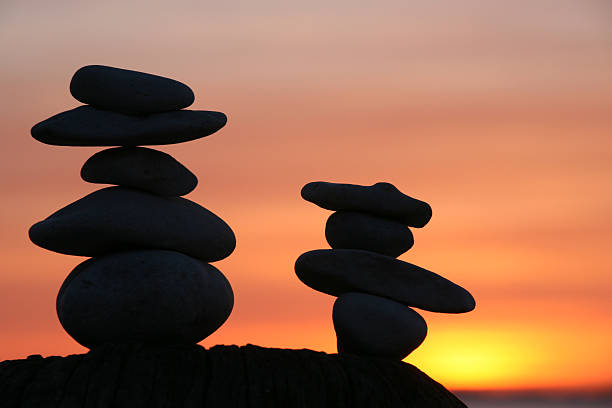 istock Silhouettes of two stack of stones during sunset 172975699