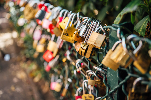 Love locks in Montmartre in front of the Sacré Coeur Basilica in Paris, France