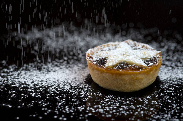 Single Christmas mince pie with icing sugar stock photo