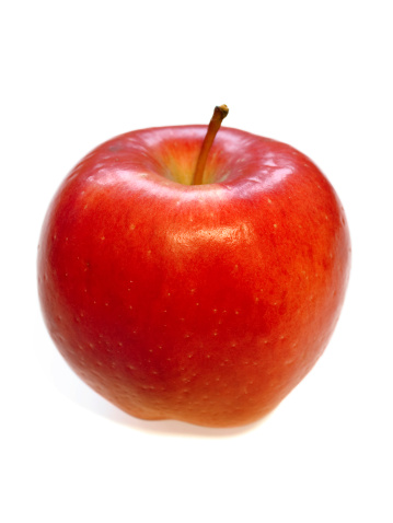 Juicy Braeburn apple isolated on a white background.