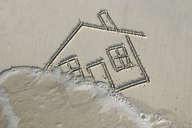 Drawing of a Home in Sand Swept Away by Wave