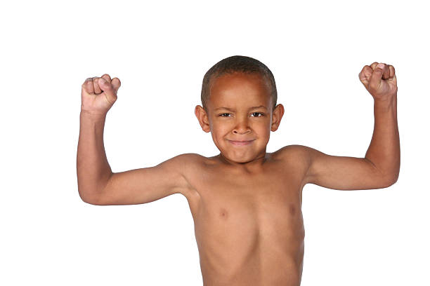 petit garçon contracter - child human muscle flexing muscles little boys photos et images de collection