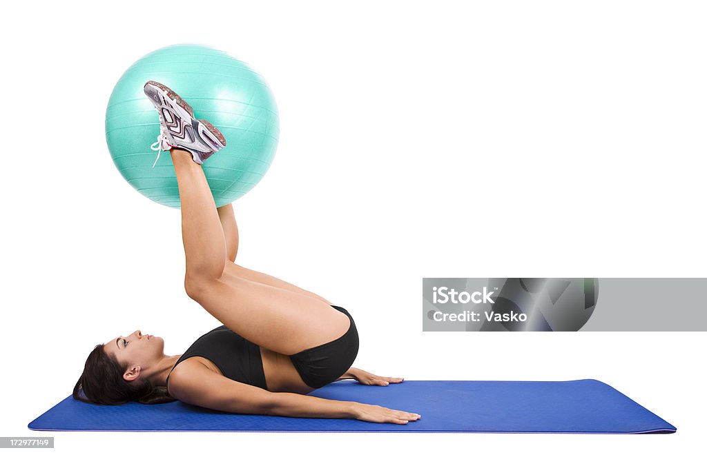 Leg & Torso Workout Picture of a model with an exercise ball. 20-24 Years Stock Photo