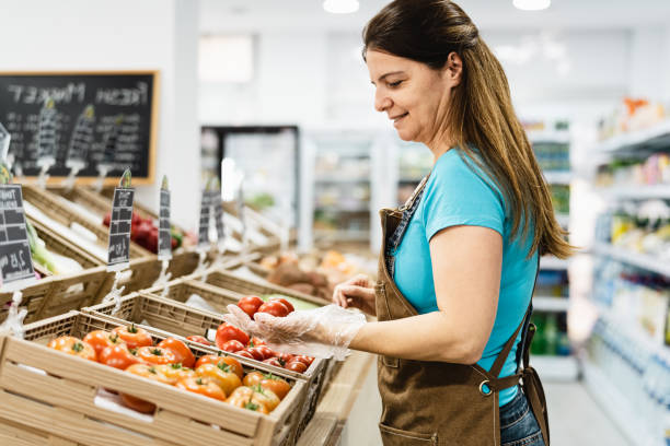 istock Happy woman working inside grocery store 1729772030