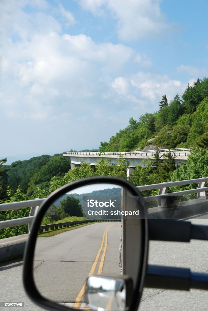 Towing an RV in the Mountains Towing an rv over a viaduct in the mountains. Camping Stock Photo