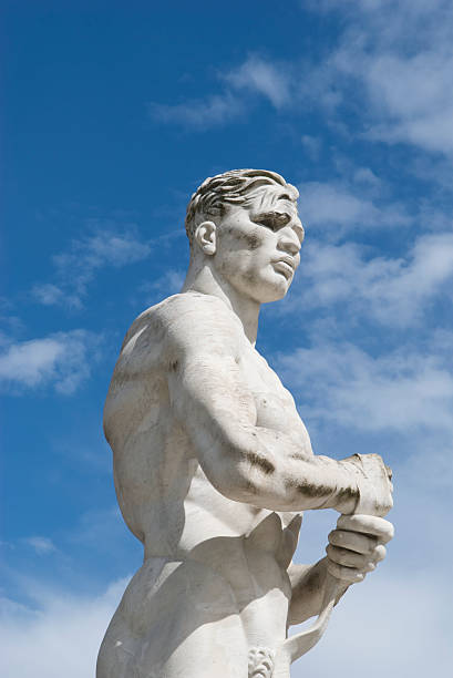 istock White Marble Muscular Athlete Boxer Statue Gets Ready for Fight 172977633