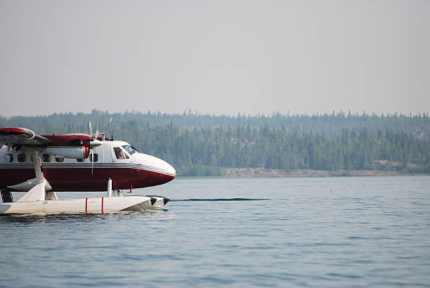 Bush Plane, Yellowknife. A Twin Otter bush plane lands on Great Slave Lake.  Click to view similar images. bush plane stock pictures, royalty-free photos & images