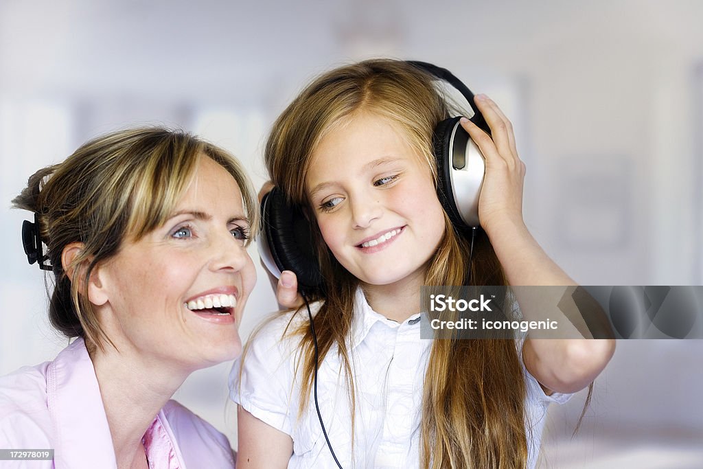 Mucis Together Mother wants to know what music her daughter likes. Focus on girl. Child Stock Photo