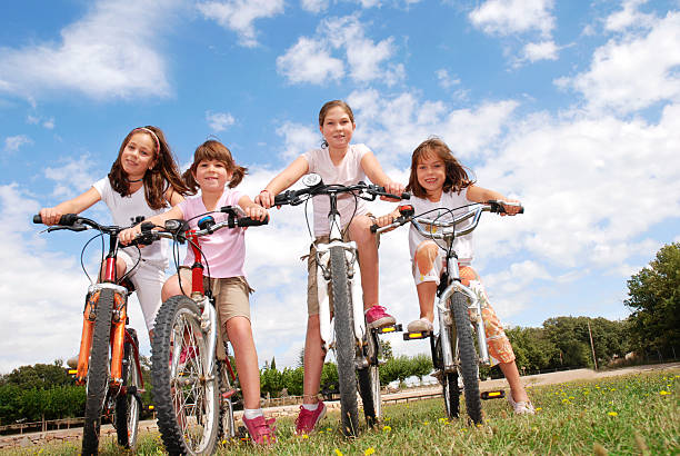 istock Four girls riding bikes 172978064