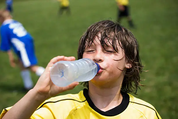 Photo of boy drinking water