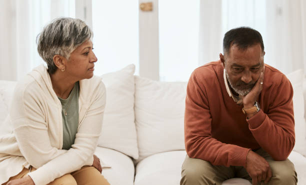 istock Divorce, fight and senior couple on sofa angry, stress and mistake, problem or issue in their home. Marriage, argue and  frustrated old woman with man in living room for debt, depression or addiction 1729784535