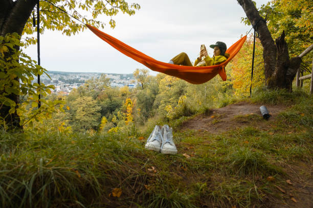 istock chilling woman laying down in hammock 1729789419
