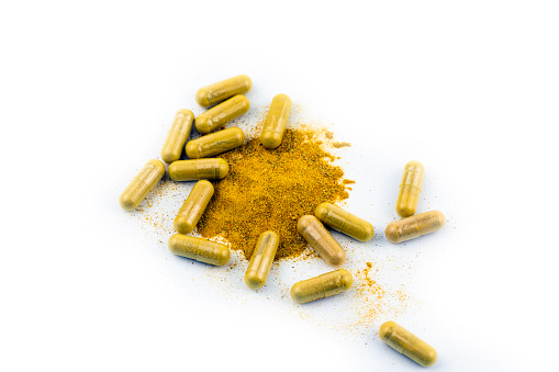 Capsules With Turmeric and Thistle as Food Supplement.