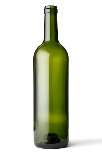 Empty green glass bottle stock photo