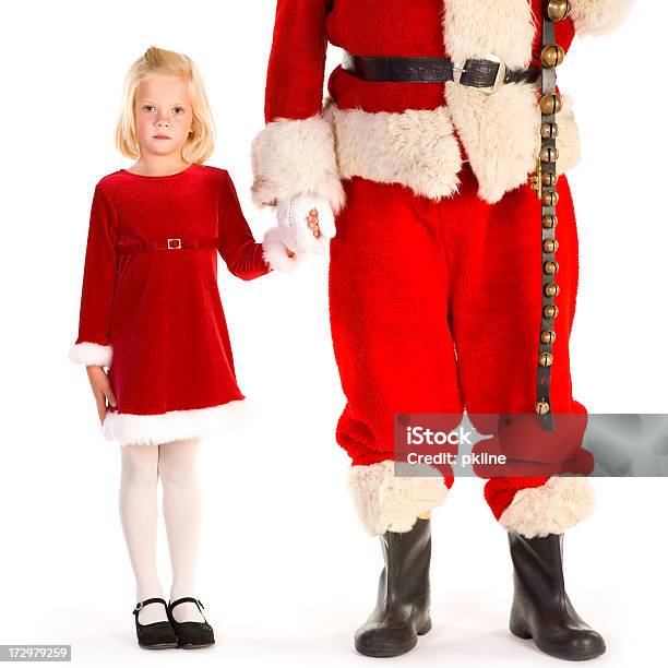 Little Girl Holding Santas Mano Mira A La Cámara Foto de stock y más banco de imágenes de 4-5 años - 4-5 años, 6-7 años, Adulto