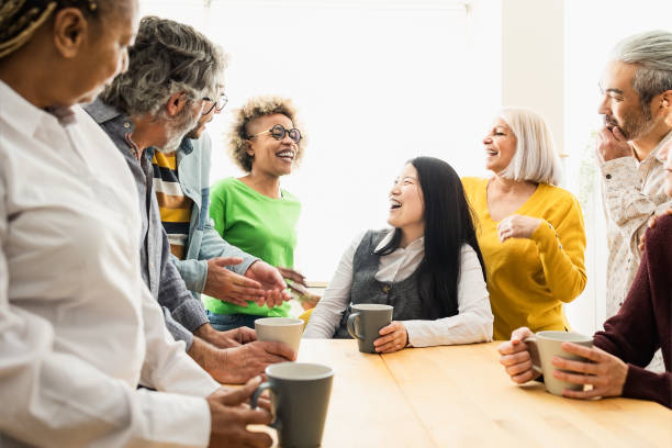 istock Happy multiracial people with different ages and ethnicities having fun drinking a cup of coffee at home 1729793268