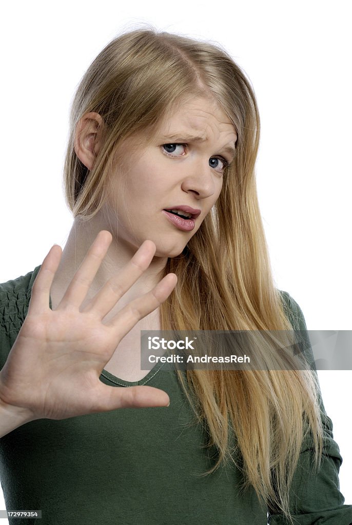 Shielding, portrait "Portrait of a 20-years old woman, anxiety facial expression. Content of a large bunch of expression portraits. More portraits from this model in her lightbox:" 20-29 Years Stock Photo