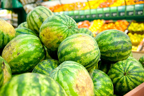 watermelons on market stock photo