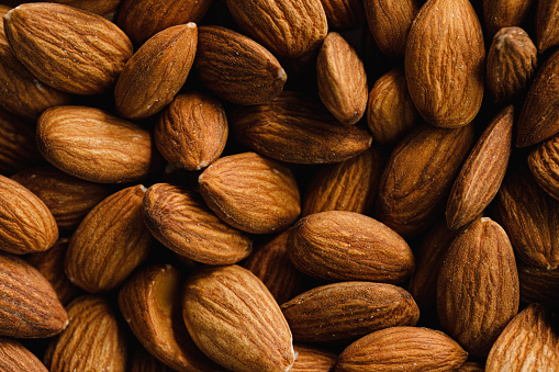 Full frame of almond nut food background. Heap of fresh Almonds.