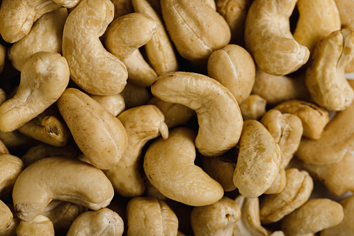 Heap of fresh cashew. Full frame of cashew nuts.