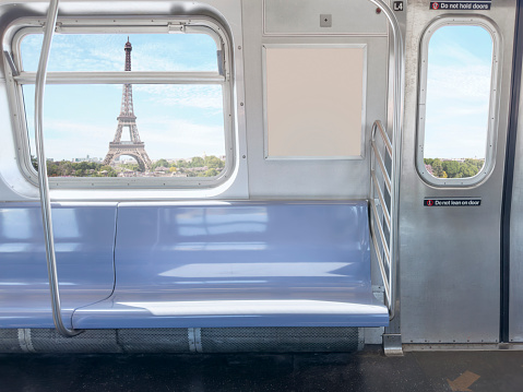 Empty train seats in Paris with Eiffel Tower in the background