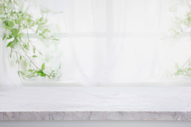 Selective focus.Elegance product display background with marble top with curtain and vine leaf on window garden in morning.minimal counter Selective focus.Elegance product display background with marble top with curtain and vine leaf on window garden in morning.minimal counter design streaky lights stock pictures, royalty-free photos & images