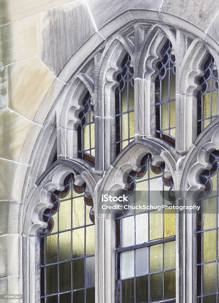 Church Stained Glass Window Stone Architecture Stained glass church window with ornate sandstone arch architecture. Abbey - Monastery Stock Photo