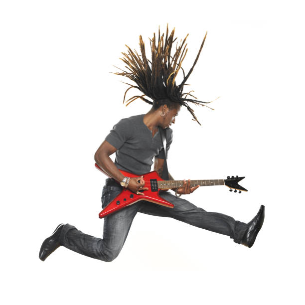 hombre tocando la guitarra eléctrica y paracaidismo - isolated on white studio shot guitar young men fotografías e imágenes de stock