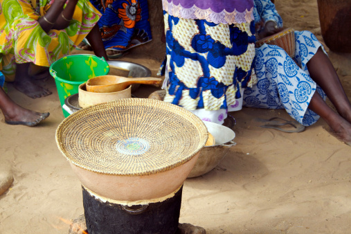 A simple but effective way of open-air cooking.  This is how cous-cous is prepared in a Senegalese village