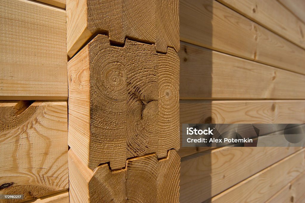 Unfinished wooden house Construction: unfinished wooden house Backgrounds Stock Photo