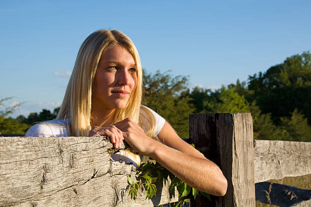 Portrait of a beautiful young summer girl Beautiful blonde woman in sunny summer or spring day outside on a meadow