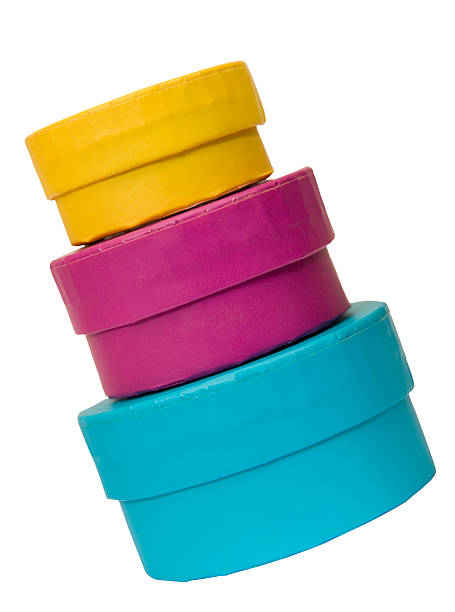 Three colourful boxes Three round, brightly-coloured boxes stacked and slanted. stacked hat boxes stock pictures, royalty-free photos & images