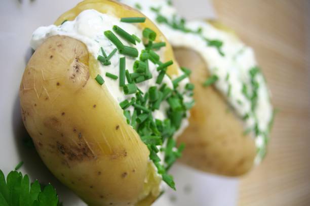 Baked Potatoes Baked Potatoes with sour cream baked potato sour cream stock pictures, royalty-free photos & images