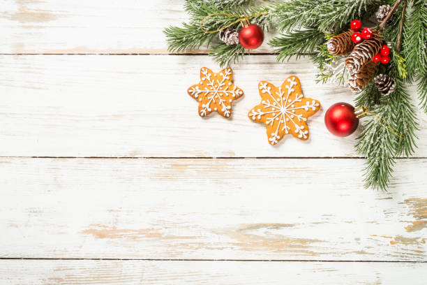 istock Christmas spices with gingerbread cookies at white table with holidays decorations. 1729834802