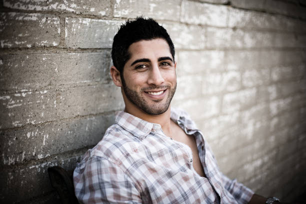 istock Smiling Young Man Sitting Outside 172983834