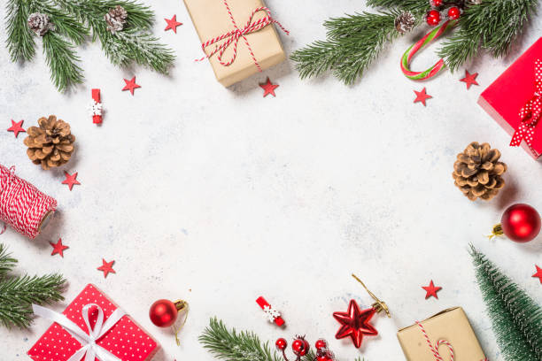 istock Christmas background with fir tree, present box and decorations. 1729844098