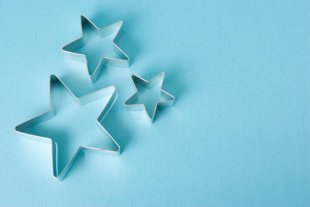 istock Star cookie cutter outline on blue 172984411