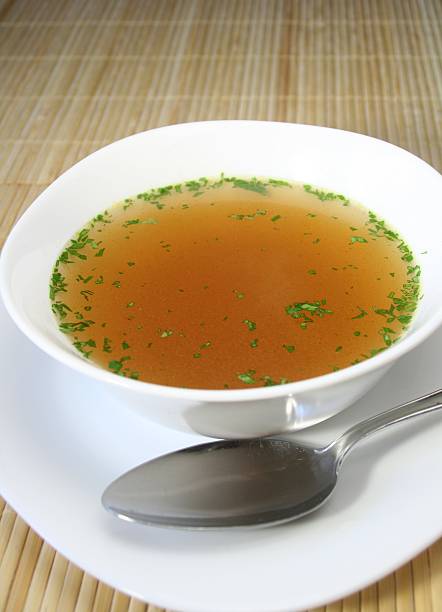 istock Soup in a white bowl with a silver spoon on the side 172984560