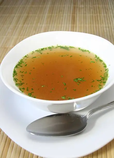 bowl of Bouillon with parsley