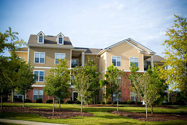 istock College Apartments against a Blue Afternoon Sky 172984733