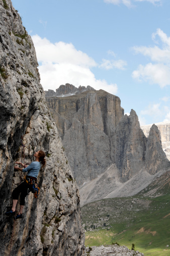 A female climber in the Italian Dolomites