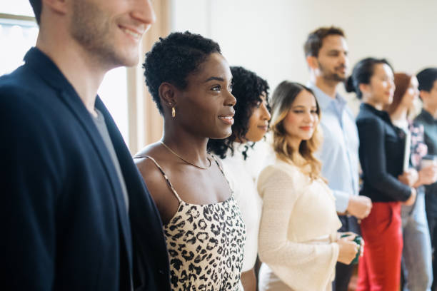 istock Team Photo In Shared Office Collective Space 1729851110